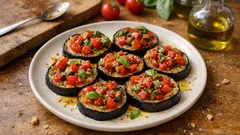 Bruschette di melanzane al forno con pomodorini e basilico: leggere e saporite
